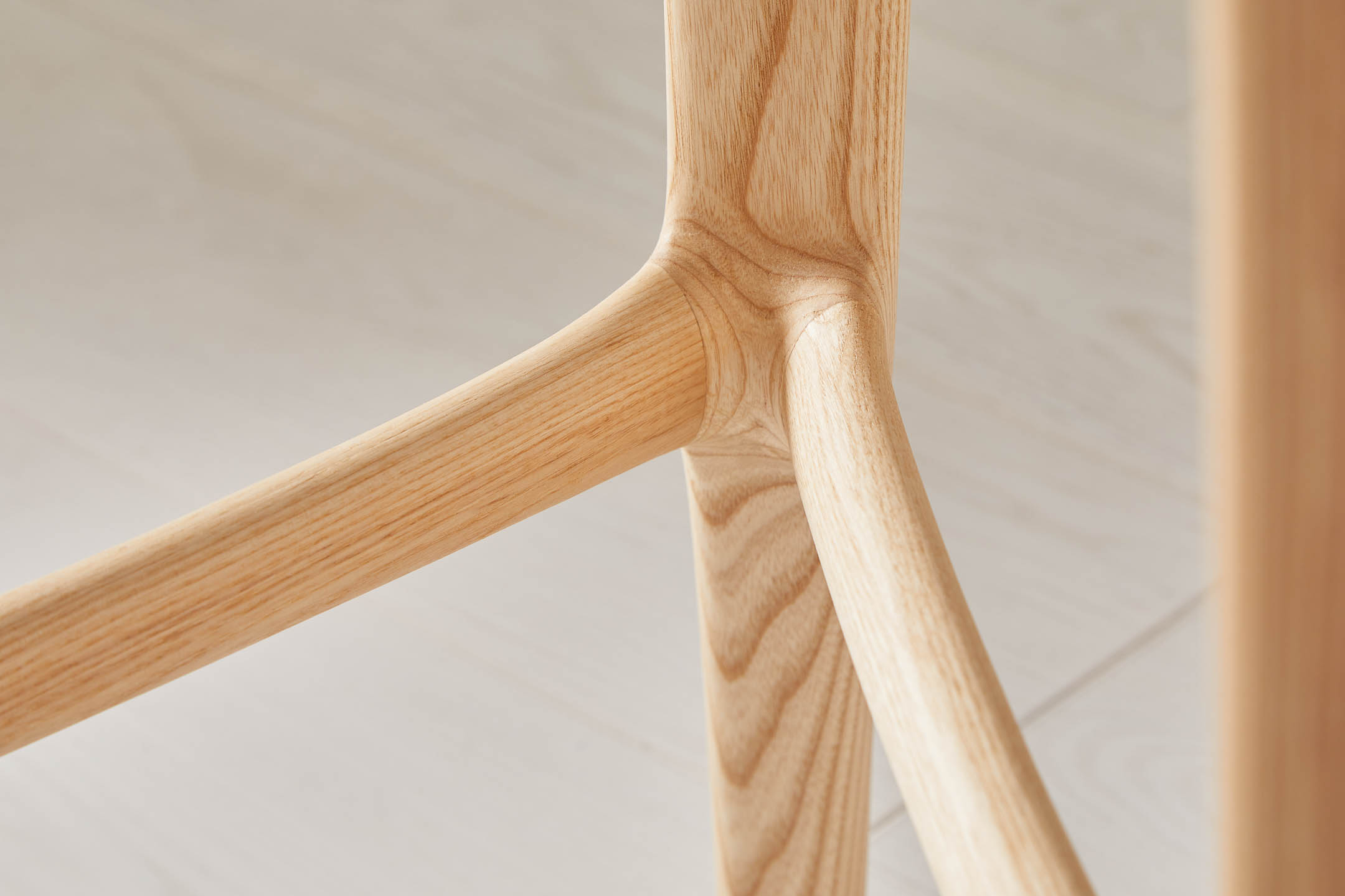 Close-up of footrest on an ash counter stool