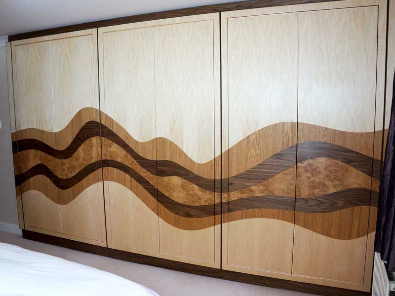 Bespoke Fitted bedroom wardrobe with wave design