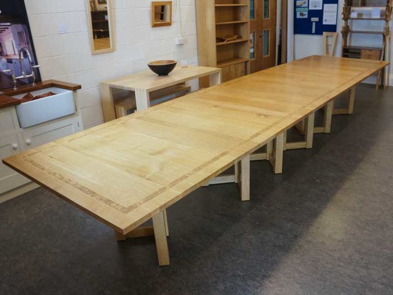 Square extending oak table with central column - Dovetailors