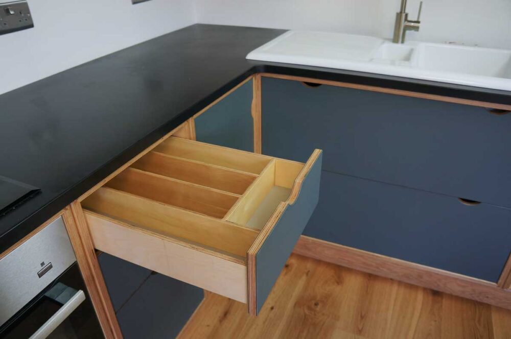 Lino and plywood kitchen by Dovetailors - bespoke cutlery drawer
