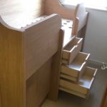 fitted look Small-bedrooms-cabin-bed-with-pull-out-desk - drawers are fitted in the stairs