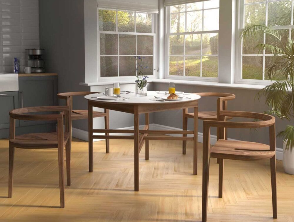 Solid Hardwood stacking chair in oak set at dining table ideal for smaller spaces